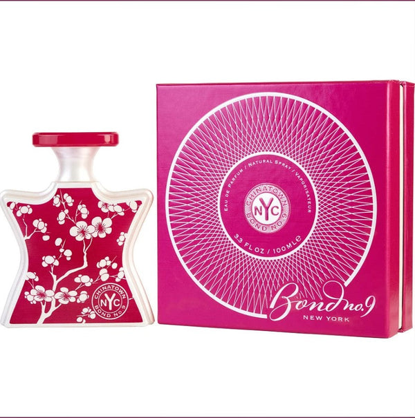 "CHINATOWN BOND No 9 3.3 OZ EDP bottle displayed elegantly against a decorative backdrop, showcasing its unique design and luxurious fragrance."