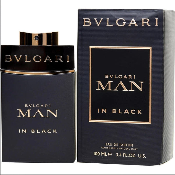 BVLGARI MAN IN BLACK 3.4 OZ EDP bottle in a dramatic setting. Available at Paris Connection Perfumes.