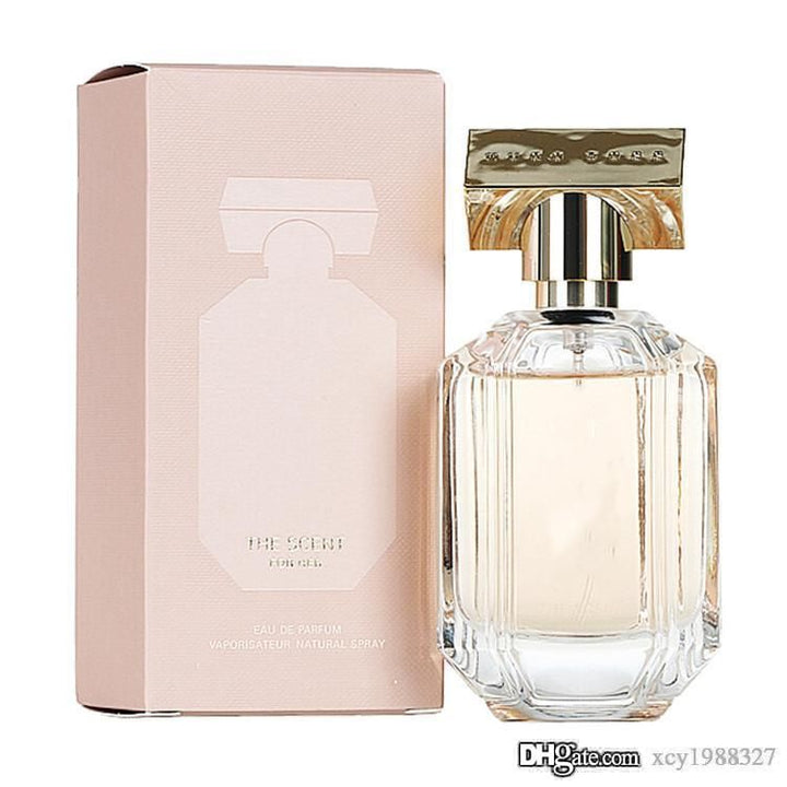 A 3.3 oz bottle of Boss The Scent Eau De Parfum Spray for Women, featuring an elegant design by Paris Connection Perfumes, offering a warm and sensual fragrance perfect for any occasion.