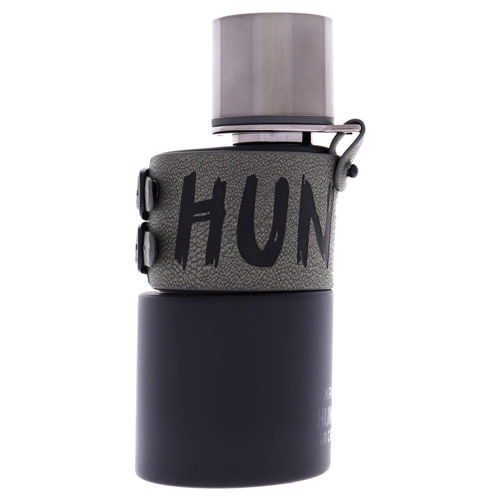 HUNTER INTENSE 3.4 OZ EDT from Paris Connection Perfumes, featuring a sleek, modern bottle with bold angles and a striking black finish, elegantly packaged in a matte black box adorned with the iconic Hunter logo.