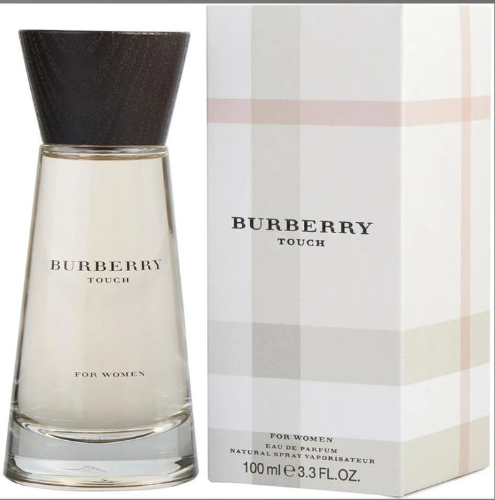 BURBERRY TOUCH 3.3 OZ EDP bottle on a pastel background. Available at Paris Connection Perfumes