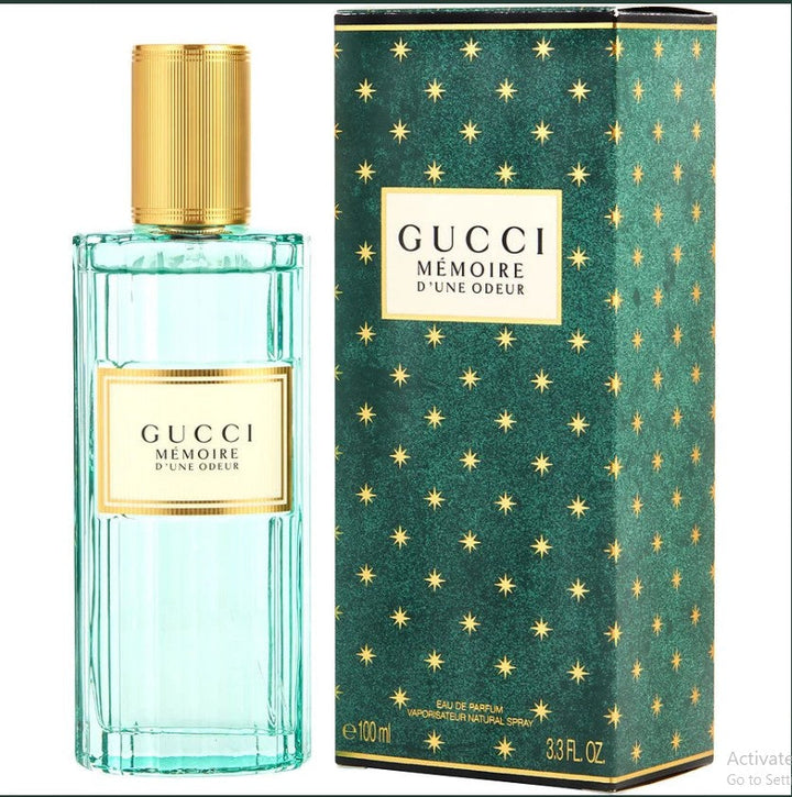 Gucci Memoire 3.3 oz Eau de Parfum bottle with floral design details. Available at Paris Connection Perfumes.