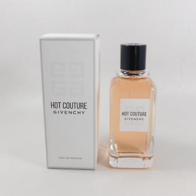 The HOT COUTURE 3.3 OZ EDP from Paris Connection Perfumes is presented in a chic, sculptural bottle that combines sleek lines and a vibrant pink color. Its sophisticated packaging highlights the alluring scent, making it a perfect addition to any perfume collection.