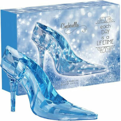 The Cinderella Blue Slipper EDP 2 oz from Paris Connection Perfumes showcases a beautifully crafted bottle shaped like a delicate slipper, elegantly presented in enchanting packaging that captures the essence of dreams and enchantment.